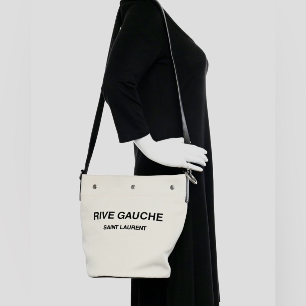 Gently used Saint Laurent Rive Gauche bucket bag. Linen with leather strap.